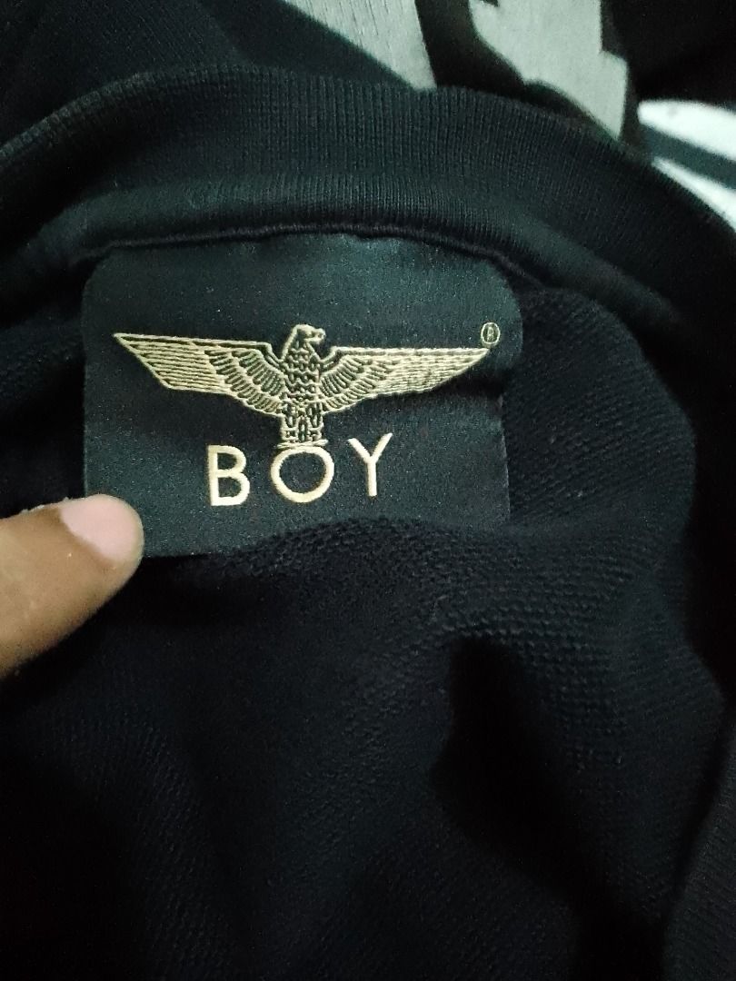 Boy London Black Eagle Logo Sweatshirt Size S (Category: Coats, Jackets and Outerwear) located in Caloocan City. Submitted by akosiwaron_thrift2600 (Listing ID 1467164043, Image 3). Description: - Brand: Boy London - Color: Black - Size: S (fits true to size) - Material: 100% cotton (breathable and comfortable) - Design: Iconic gold eagle logo on chest, large graphic wing print across the back - Details: Ribbed crew neck, cuffs, and hem with webs
