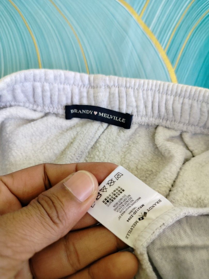 Brandy Melville Light Grey Sweat Shorts (Category: Shorts) located in Manila. Submitted by virgiliosa38485 (Listing ID 1467112650, Image 2). Description: - Brand: Brandy Melville -Waist 22-32 - Color: Light grey - Model number: MR212D-Z094 (Tag attached) - Material: Soft fleece-lined interior - Waistband: Elastic with adjustable drawstring ties - Features: Convenient side pockets and relaxed fit with curved hems - Condition: Brand new with tags.