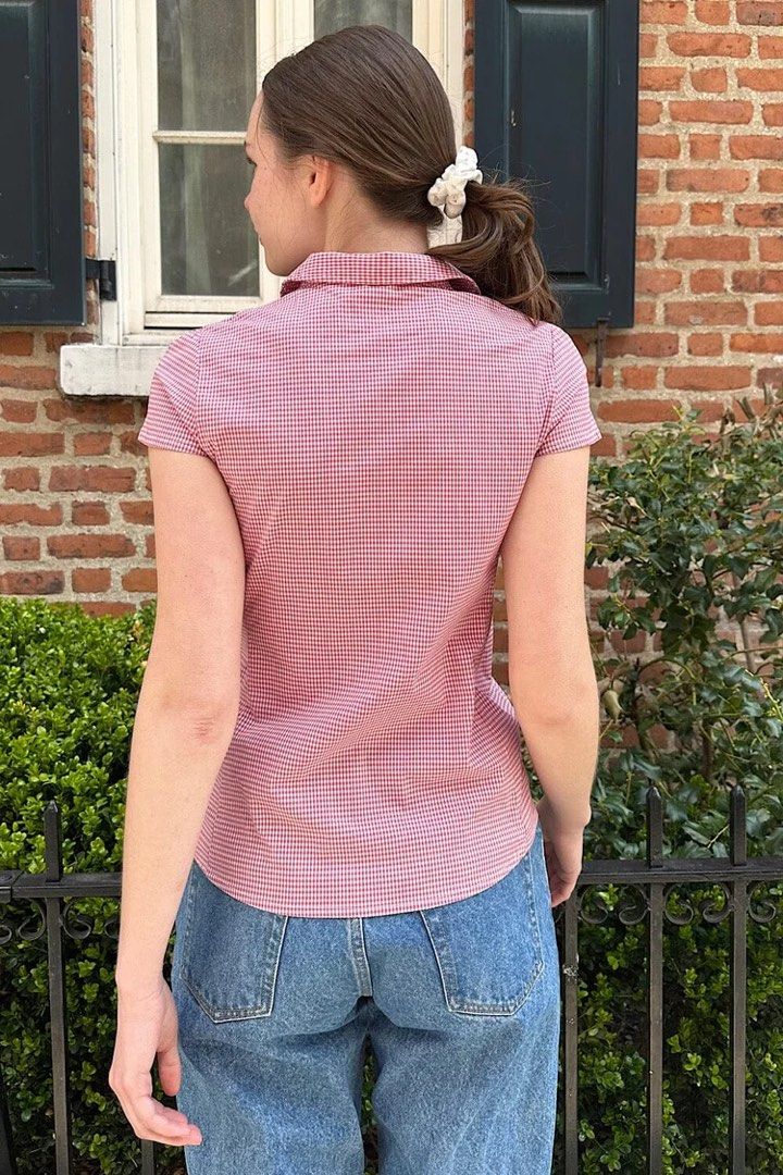 Brandy Melville Rue Plaid Top (Category: Blouses) located in Taguig. Submitted by xiurecsz (Listing ID 1467026241, Image 2). Description: Red and white gingham print blouse from Brandy Melville. Short sleeves, collared neckline with scalloped white trim, button-down front. Fitted cut. Worn once, washed and clean. Great basic for summer or layering..