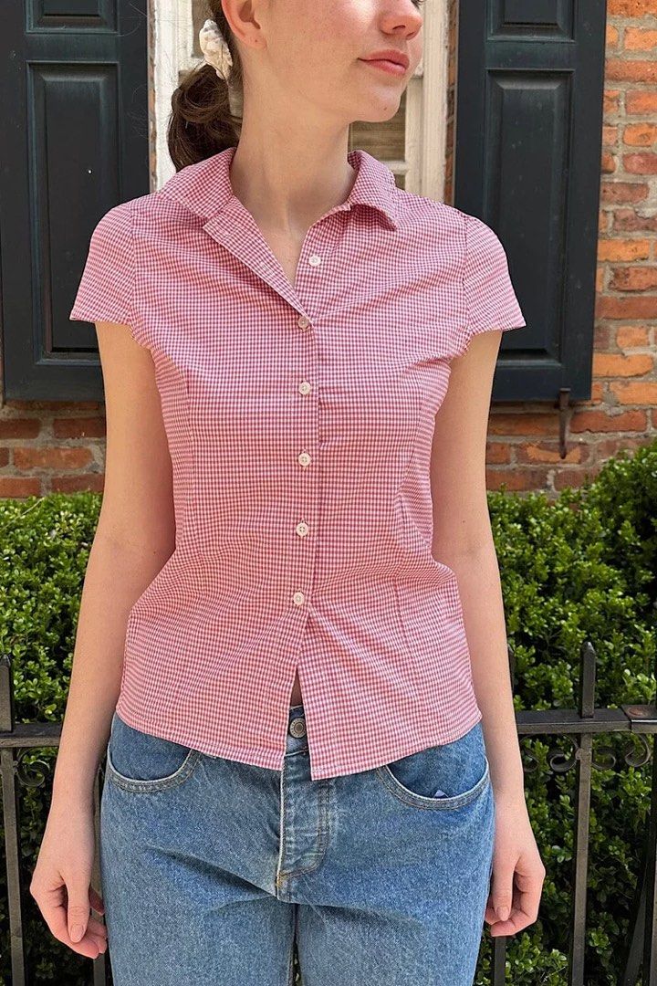 Brandy Melville Rue Plaid Top (Category: Blouses) located in Taguig. Submitted by xiurecsz (Listing ID 1467026241, Image 1). Description: Red and white gingham print blouse from Brandy Melville. Short sleeves, collared neckline with scalloped white trim, button-down front. Fitted cut. Worn once, washed and clean. Great basic for summer or layering..