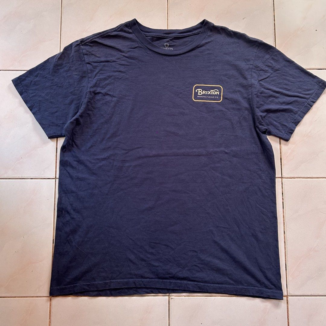 Brixton Manufacturing Co 🔥 (Category: Tshirts & Polo Shirts ) located in Jinoba-an. Submitted by eegiboy (Listing ID 1467089950, Image 1). Description: - Brand: Brixton Manufacturing Co. - Color: Navy blue - Size: Large (Standard fit) 22/28 - Material: 100% Cotton, Made in Mexico - Design: Small logo box on front left chest; larger matching graphic on upper back - Care: Machine washable 550plussf dm me if interested thankyou.
