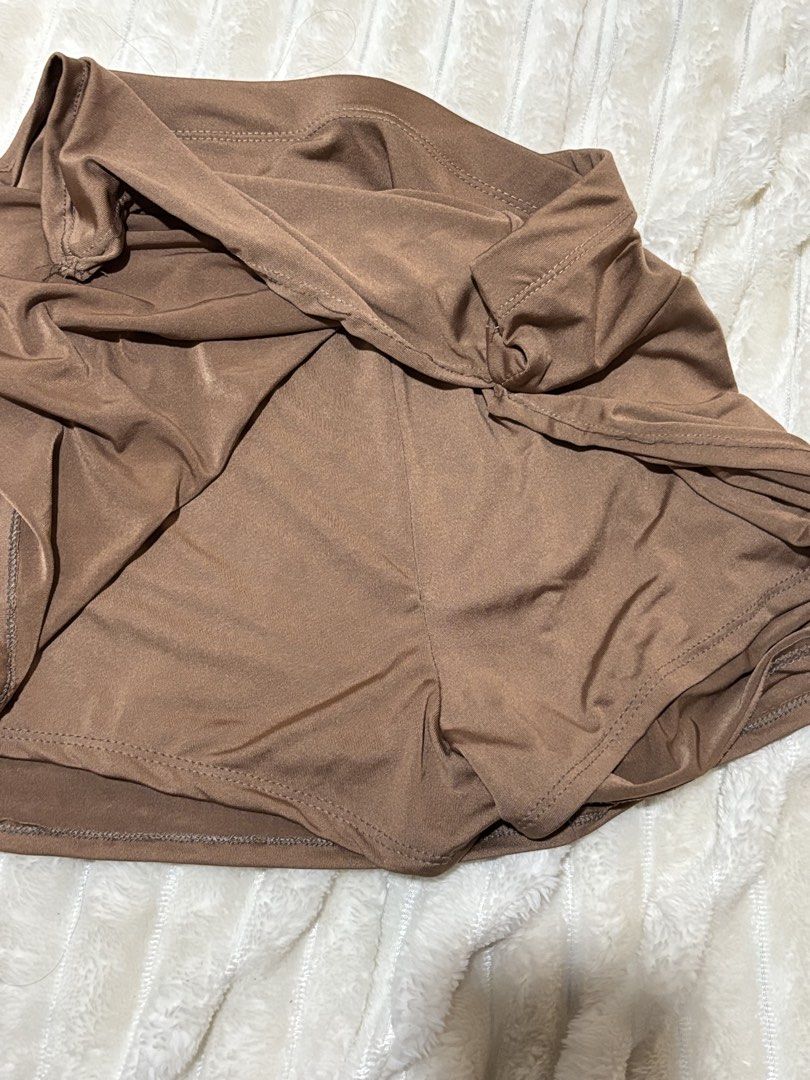 Brown Athletic Skort with Built-in Shorts (Category: Skirts) located in Quezon City. Submitted by hadescloset (Listing ID 1467057344, Image 2). Description: - Color: Solid brown - Design: High waistband with built-in shorts for extra coverage - Material: Smooth and stretchy fabric for active movement - Best for: Tennis, running, or everyday casual wear - Condition: Brand new / Excellent quality - Mode of Payment: GCash, BPI, BDO - Shipping: J&T E