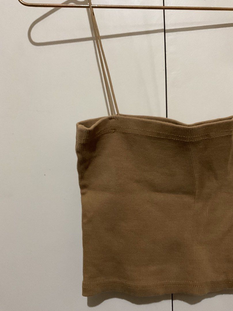 Brown ribbed spaghetti strap crop cami top (Category: Sleeveless) located in Makati City. Submitted by style.preloved (Listing ID 1467152743, Image 2). Description: • Can stretch to fit M-L frames.