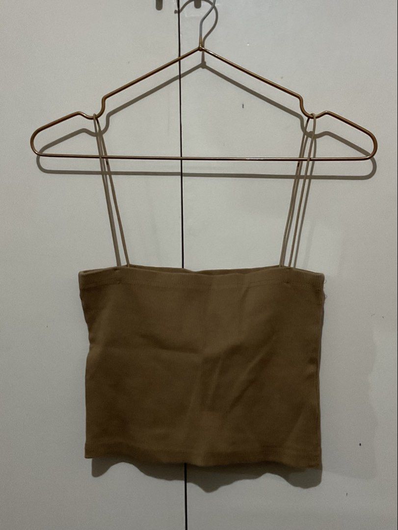 Brown ribbed spaghetti strap crop cami top (Category: Sleeveless) located in Makati City. Submitted by style.preloved (Listing ID 1467152743, Image 1). Description: • Can stretch to fit M-L frames.