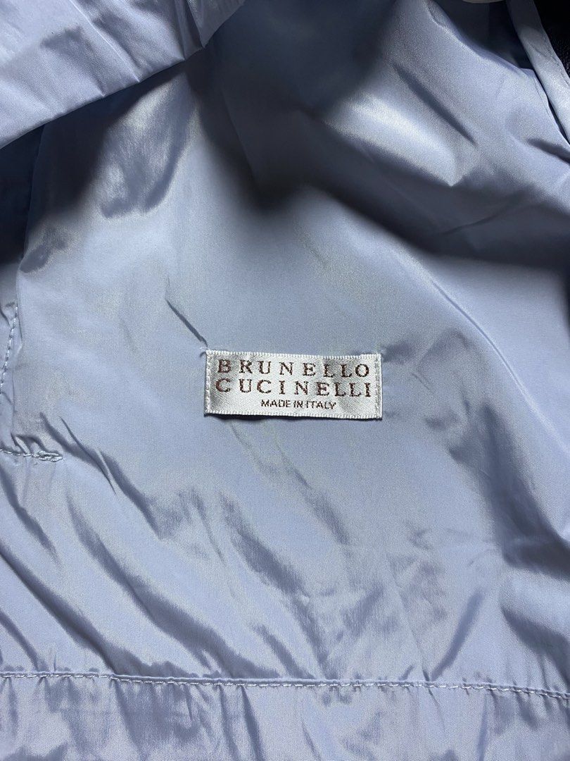 Brunello Cucinelli Light Blue Short Sleeve Bomber Jacket Size 38 (Category: Luxury Apparel) located in Olongapo. Submitted by copnsold (Listing ID 1466988902, Image 3). Description: Light blue nylon bomber jacket from Brunello Cucinelli. Short sleeves with metallic sparkle trim down shoulders. Ribbed black collar, full zip front closure, dual zip pockets at lower front, adjustable drawstring hem. Made in Italy. Size 38 label inside. 21” Length 20