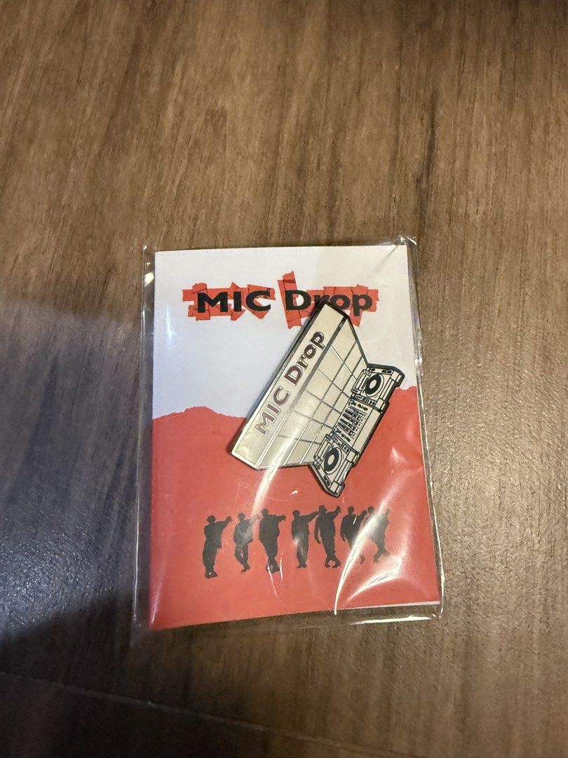 BTS Mic Drop enamel pin (Category: K-Wave Merchandise) located in Marikina City. Submitted by culose (Listing ID 1467112403, Image 1). Description: - Item: BTS Mic Drop Enamel Pin - Design: DJ booth with members silhouette - Condition: Brand new, still sealed in original plastic - Perfect for: K-pop collectors and ARMY fans.