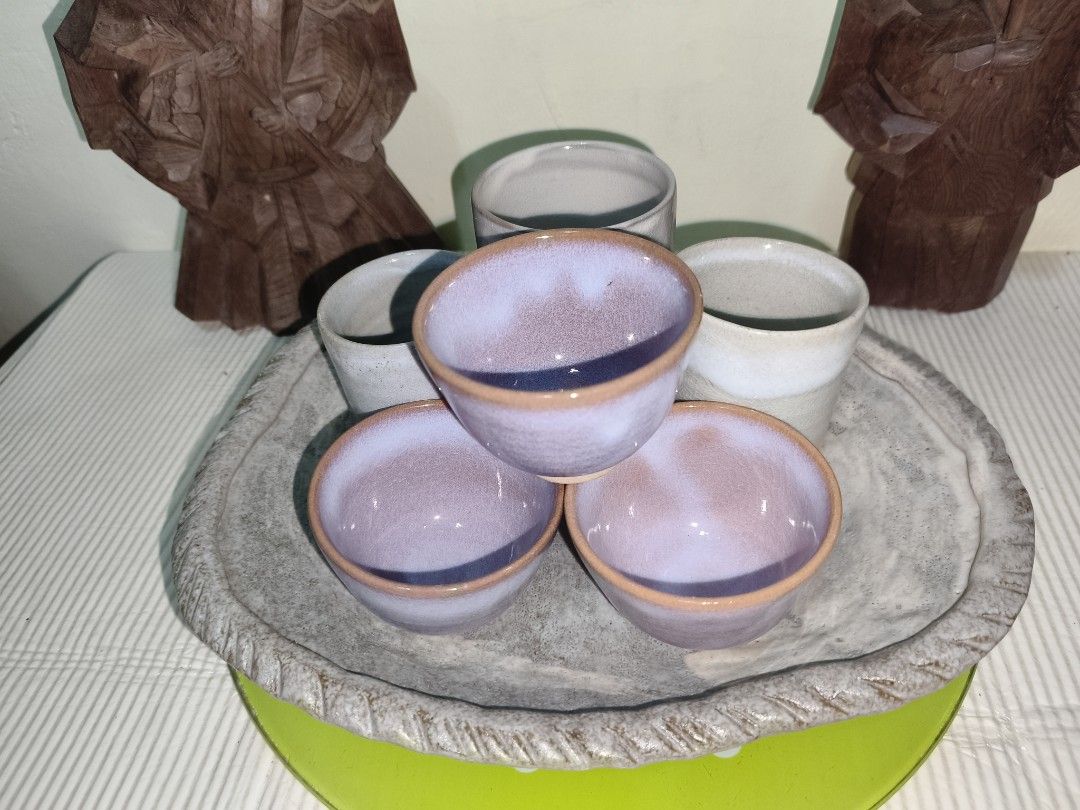 Bundle babasagin (Category: Coffee & Tea Tableware) located in Manila. Submitted by reascheyss51406 (Listing ID 1467055853, Image 1). Description: - Handmade artisan ceramic set - Includes 3 purple glazed cups & 3 tall neutral cylindrical cups - Comes with a large grey textured serving plate - Distinctive earthy terracotta rims on the base of each piece - Beautiful addition to any tea collection or kitchen decor.
