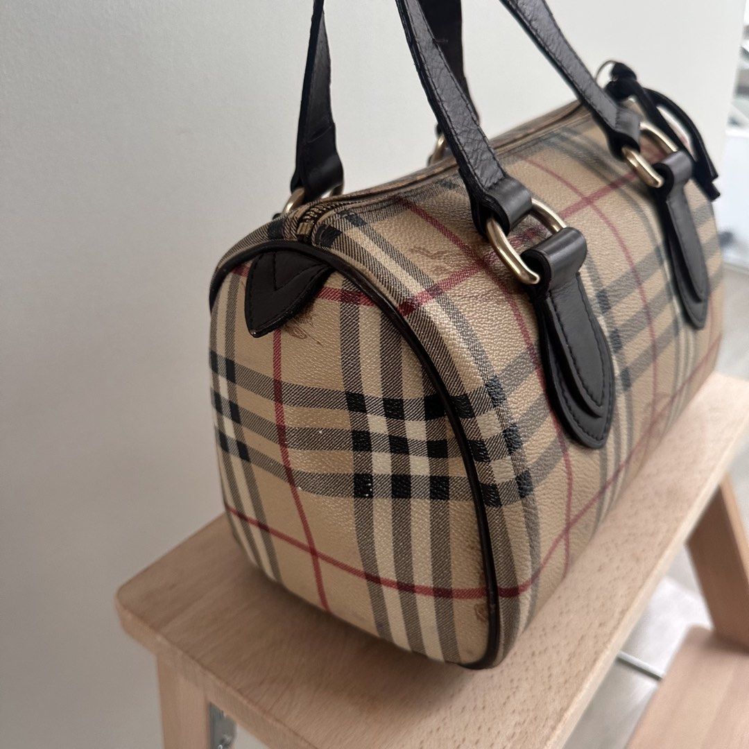 Burberry Vintage Nova Check Barrel Handbag (Category: Luxury Bags & Wallets) located in Paranaque City. Submitted by closetmalou (Listing ID 1467120888, Image 3). Description: Vintage Burberry Check Bowling Bag Classic beige Burberry check pattern with dark brown leather handles and trim, gold-tone hardware, and a zip-top closure. Features a spacious interior for everyday essentials. Measurements: * Width: 11 inches * Height: 8 inches * Depth: 6 