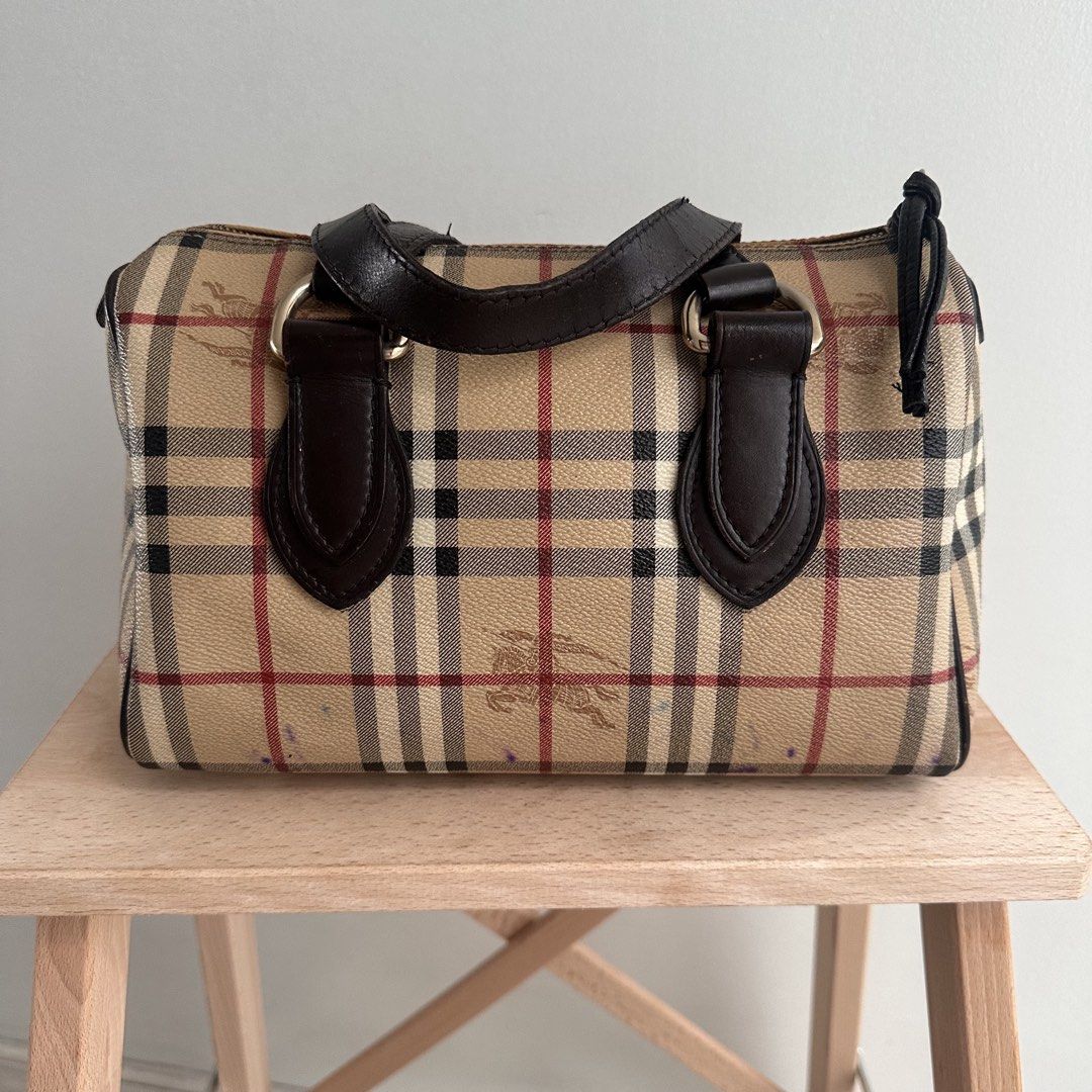 Burberry Vintage Nova Check Barrel Handbag (Category: Luxury Bags & Wallets) located in Paranaque City. Submitted by closetmalou (Listing ID 1467120888, Image 1). Description: Vintage Burberry Check Bowling Bag Classic beige Burberry check pattern with dark brown leather handles and trim, gold-tone hardware, and a zip-top closure. Features a spacious interior for everyday essentials. Measurements: * Width: 11 inches * Height: 8 inches * Depth: 6 