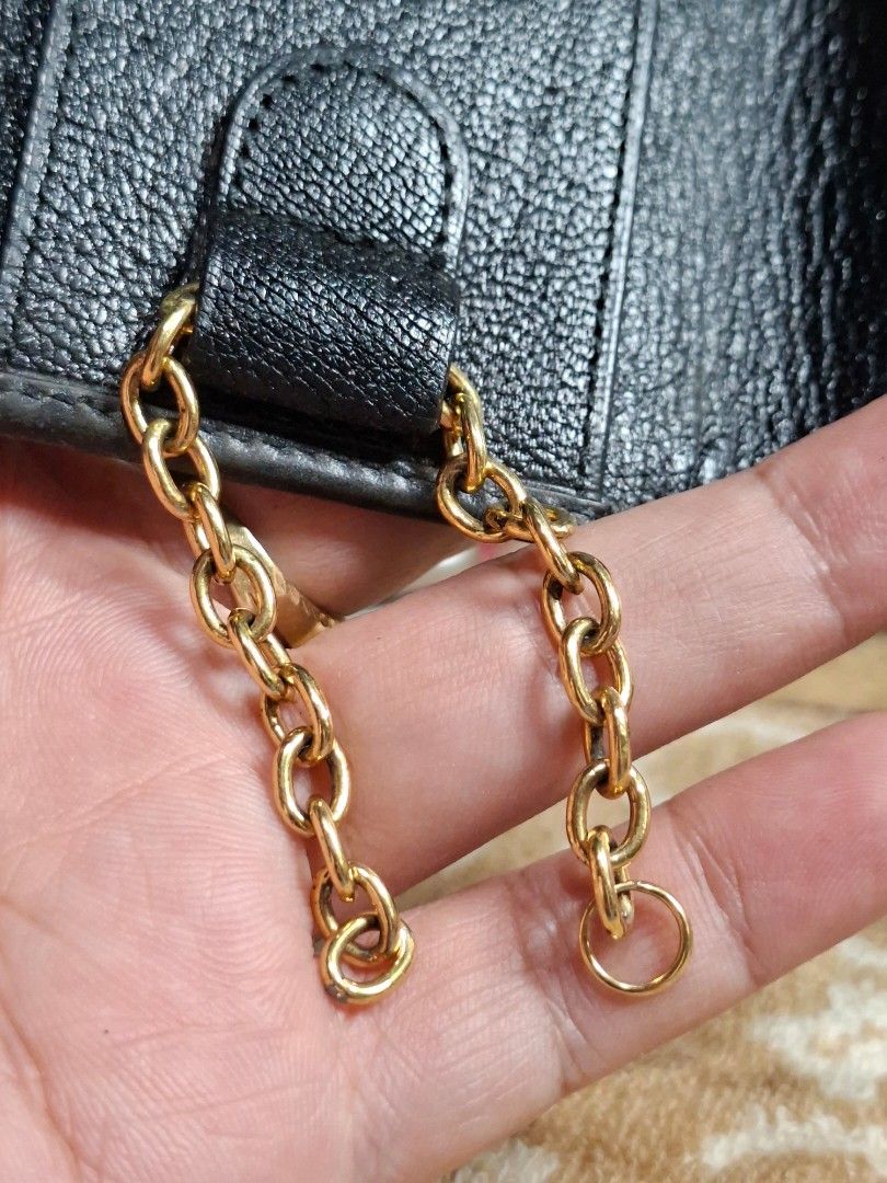 Bvlgari Black Leather 6-Hook Key Case (Category: Luxury Bags & Wallets) located in Lucena. Submitted by dai_suki (Listing ID 1466980638, Image 3). Description: - Brand: Bvlgari - Material: Black textured leather with gold-tone hardware - Design: Front flap with double BVLGARI pa rings - Interior: 6 key hooks and a side chain attachment - Closure: Secure snap button (fully functional) - Condition: Minor handling signs, light edge wear, and standar