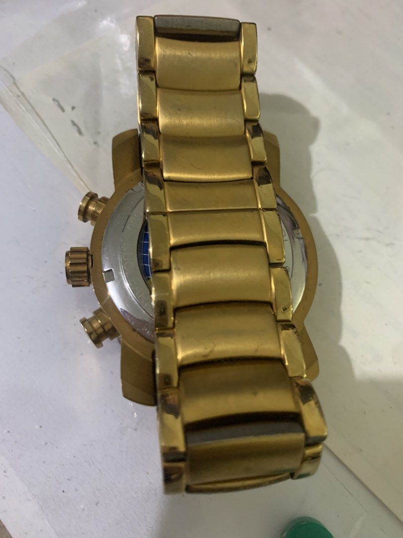 Bvlgari Gold Tone Chronograph Watch (Category: Men's Watches) located in Paranaque City. Submitted by declutterby4angels (Listing ID 1467123318, Image 3). Description: - Brand: Bvlgari - Design: Gold-tone finish with skeletal dial and matching metal link bracelet - Features: Multiple sub-dials, tachymeter bezel, date window, and decorative case back - Condition: Overall signs of wear on the gold plating from previous use - Includes: Crown and fun