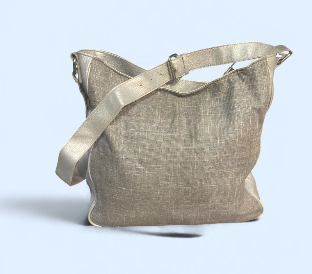 Calvin Klein Grey Crossbody Shoulder Bag - Authentic (Category: Cross-body Bags) located in San Pedro. Submitted by lifebeginsaftercoff33 (Listing ID 1467072243, Image 3). Description: - Authentic Calvin Klein crossbody shoulder bag - Chic grey woven texture canvas fabric with solid grey faux leather trim - Adjustable strap with buckle and sleek branded front metal plaque - Secure magnetic snap top closure - Roomy slouchy interior lined with CK l