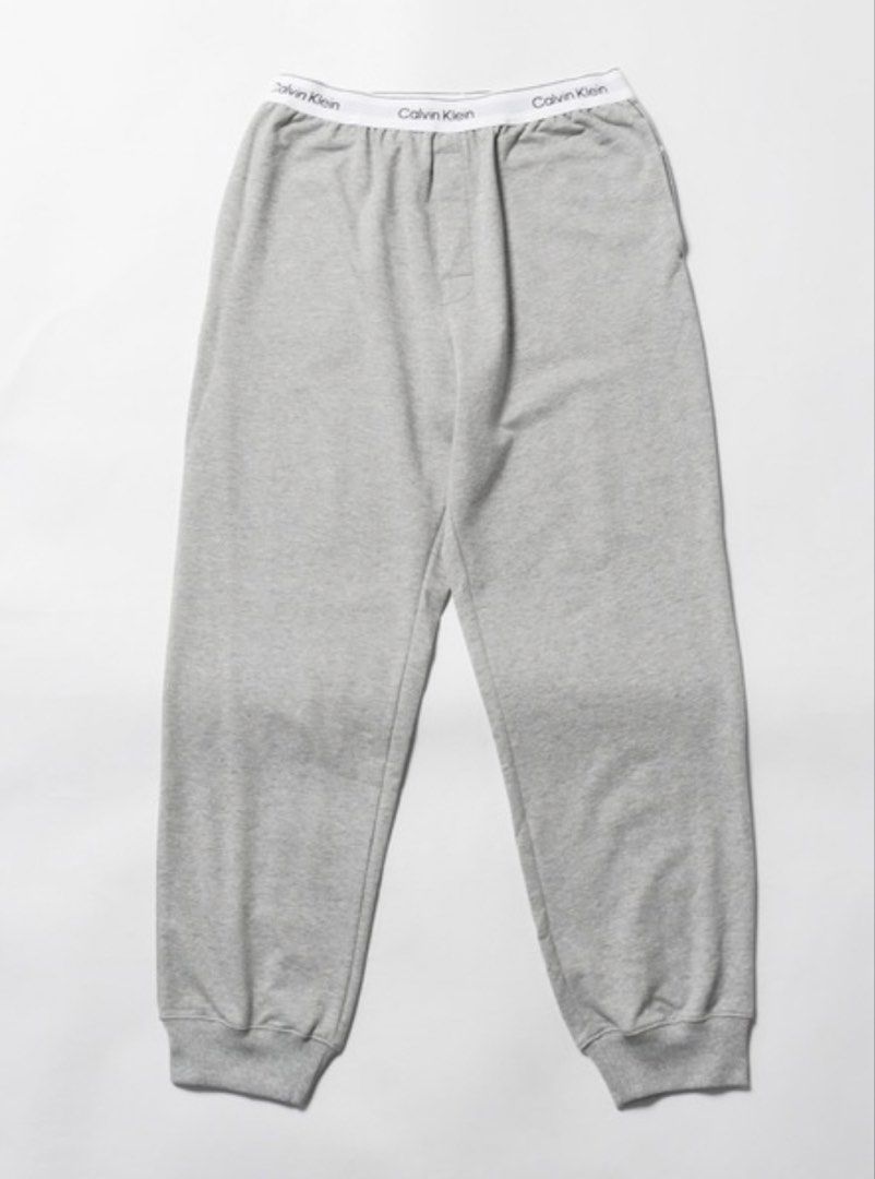 Calvin Klein Grey Jogger Pants (Category: Sleep and Loungewear) located in General Tinio. Submitted by strawberrieees (Listing ID 1467067474, Image 1). Description: - Brand: Calvin Klein - Item: Sleepwear / Lounge Pants - Color: Heather Grey - Size: S on tag but can fit to 26-30 -Length: 35 - Features: Branded elastic waistband, ribbed ankle cuffs - FIXED PRICE‼️ - MOP: Gcash -J&T ONLY.