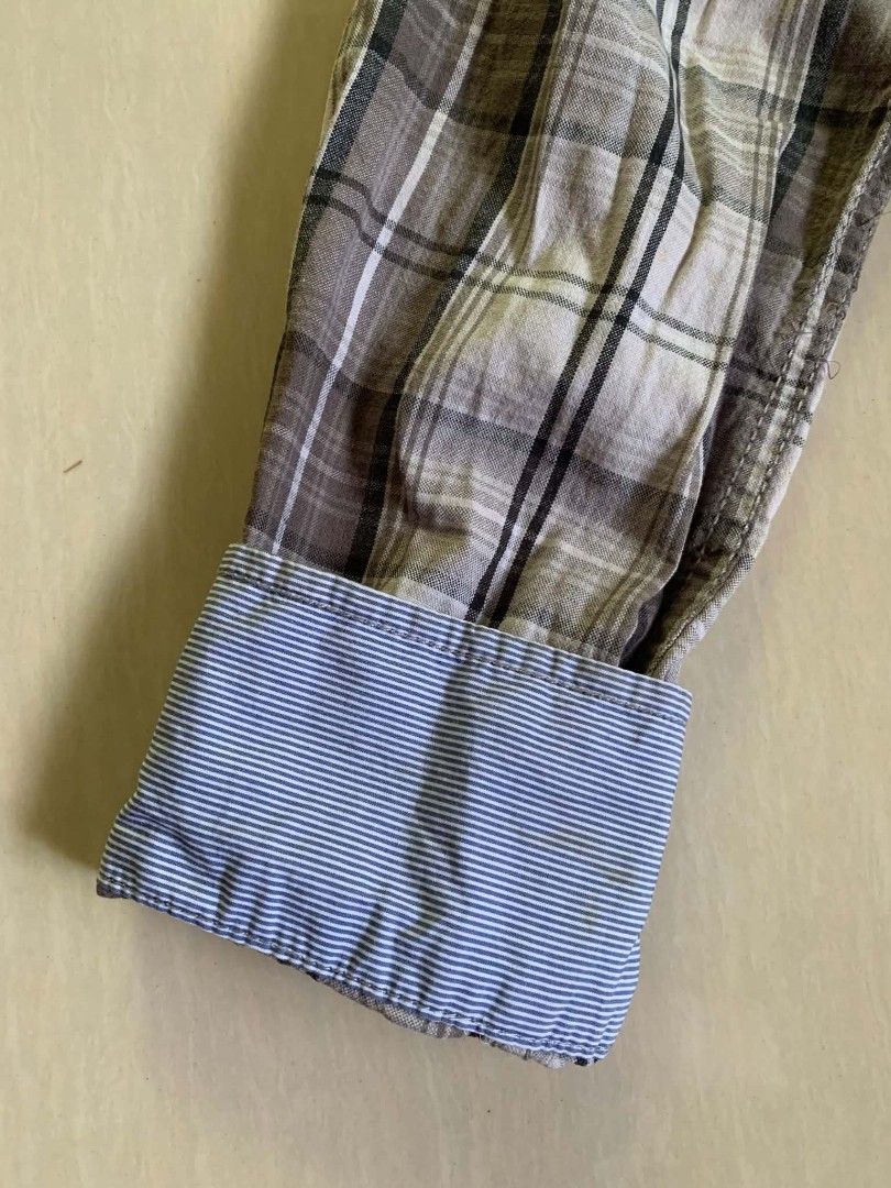Calvin Klein Jeans Plaid Button-Down Shirt Size S (Category: Sleep and Loungewear) located in Tiaong. Submitted by cdoswan (Listing ID 1467038485, Image 3). Description: - Brand: Calvin Klein Jeans - Style: Long-sleeve button-down shirt - Size: S - Color/Pattern: Brown and white plaid - Details: Two button-flap chest pockets, contrast blue and white striped fabric inside collar and cuffs - Origin: Made in China - Condition: Excellent pre-loved co