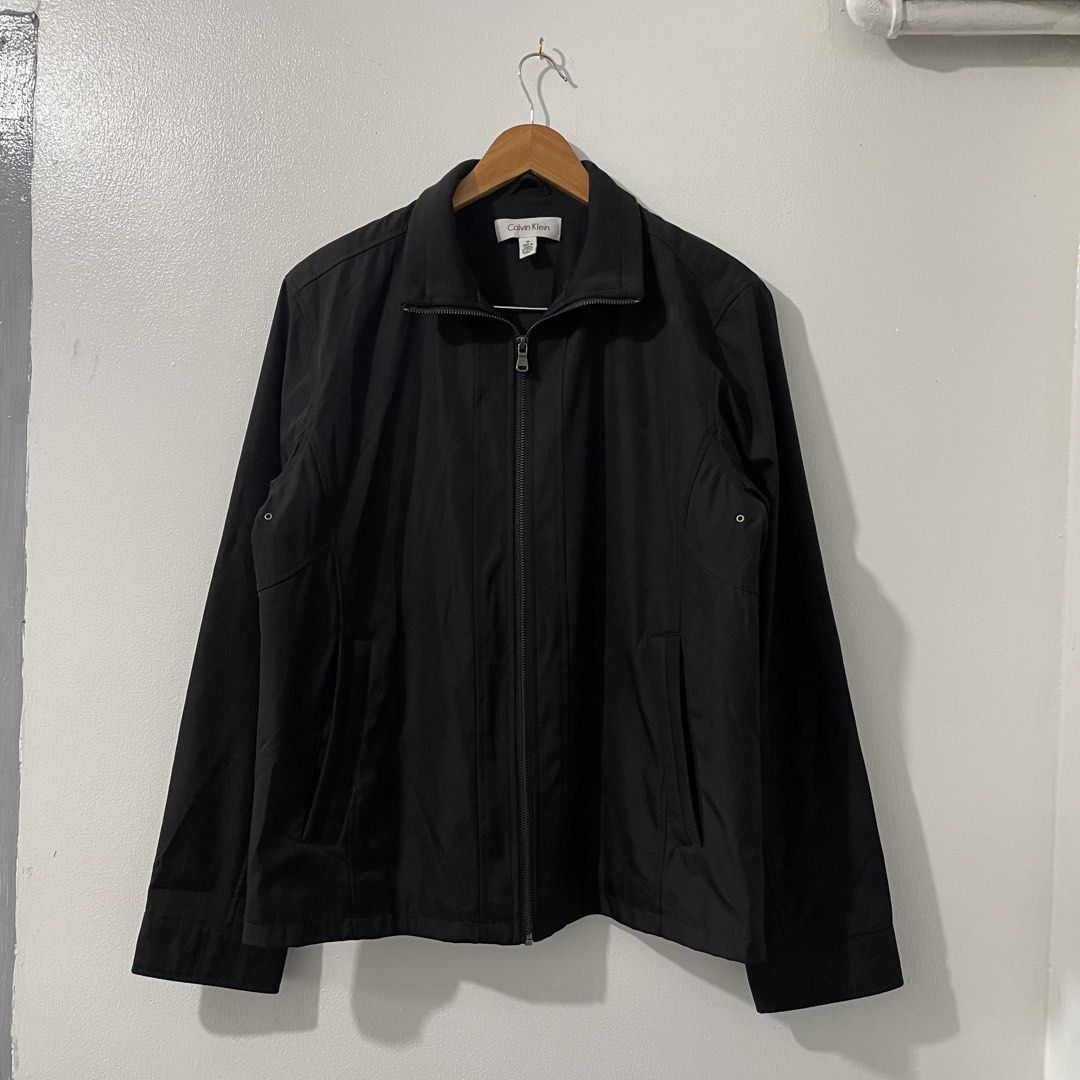 Calvin Klein Men's Zip Up Jacket (Medium) (Category: Coats, Jackets and Outerwear) located in Quezon City. Submitted by 2h3nji (Listing ID 1467013111, Image 1). Description: Calvin Klein Men's Zip Up Jacket • Medium (Can fit to Large) • 23x27 • Black • 10/10 color rate • Good as new • No issues 1,500💵 Tandang Sora, QC📍.