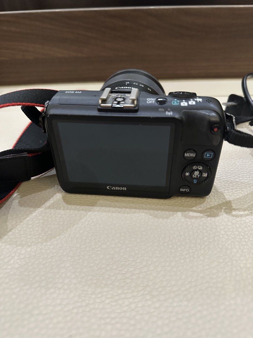 Canon EOS M2 18-55mm Lens (Category: Cameras) located in Quezon City. Submitted by bqchane (Listing ID 1467119901, Image 2). Description: - Model: Canon EOS M2 Mirrorless Camera (Black) - Lens: 18-55mm zoom lens included - Accessories: Neck strap and original battery charger - Features: Compact body, interchangeable lens mount, rear LCD screen, top hot shoe, and standard dials - Condition: 100% working, great for travel and daily shooting, ready 