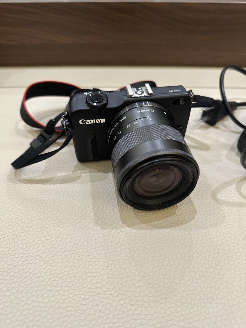 Canon EOS M2 18-55mm Lens (Category: Cameras) located in Quezon City. Submitted by bqchane (Listing ID 1467119901, Image 1). Description: - Model: Canon EOS M2 Mirrorless Camera (Black) - Lens: 18-55mm zoom lens included - Accessories: Neck strap and original battery charger - Features: Compact body, interchangeable lens mount, rear LCD screen, top hot shoe, and standard dials - Condition: 100% working, great for travel and daily shooting, ready 