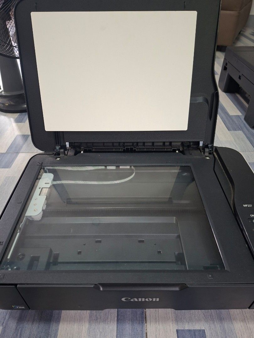 Canon Pixma MP237 Printer (Category: Printers, Scanners & Copiers) located in Manila. Submitted by ninyagauri24333 (Listing ID 1467011538, Image 2). Description: - Model: Canon Pixma MP237 Multi-Function Inkjet Printer - Color: Sleek Black - Condition: Powers on via top button, fully functional flatbed printer/scanner - Features: Top panel with easy-to-use buttons and indicator lights - Design: Convenient paper tray attached on the left side - Pe