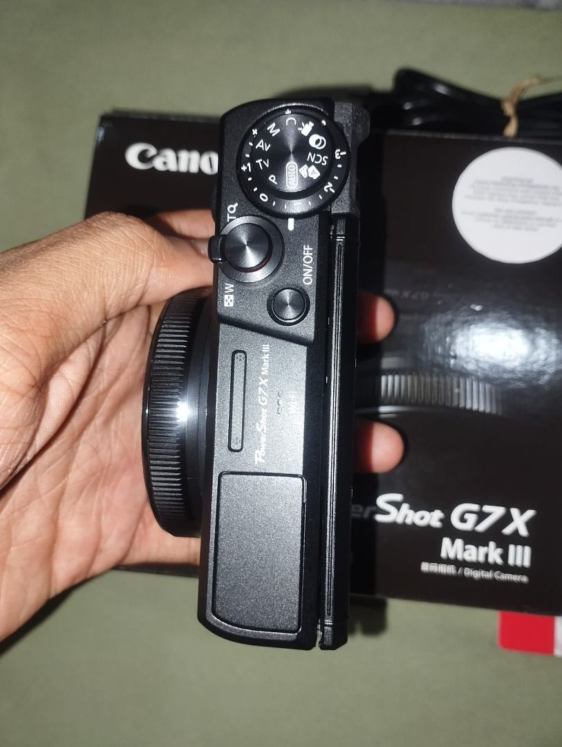 Canon PowerShot G7 X Mark III Digital Camera (Category: Cameras) located in Quezon City. Submitted by roxaschloeeex (Listing ID 1467164271, Image 1). Description: - Model: Canon PowerShot G7 X Mark III (Black) - Condition: Excellent, clean body with zero scratches and fully intact controls - Features: Compact pocket size, powerful zoom lens, and fully functional flip-up screen - Hardware: Battery compartment and port covers close tightly - Inclus