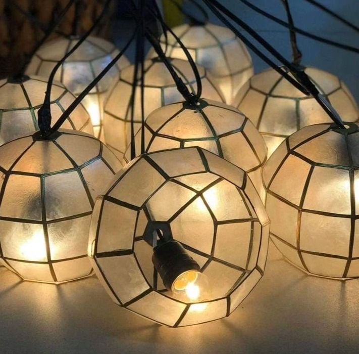 Capiz Balls and Lanterns (Category: Other Home Decor) located in Manila. Submitted by glenndy_07 (Listing ID 1466992832, Image 2). Description: Capiz Balls and Lanterns Price List: ​4 inch diameter: P1,750 (10 pcs) 6 inch diameter: P1,950 (10 pcs) 8 inch diameter: P2,850 (10 pcs) 10 inch diameter: P3,750 (6 pcs) Key Features: Sizes: 4", 6", 8", and 10" diameter options Inclusions: Wires and peanut light bulbs Voltage Options:220V Available Colour