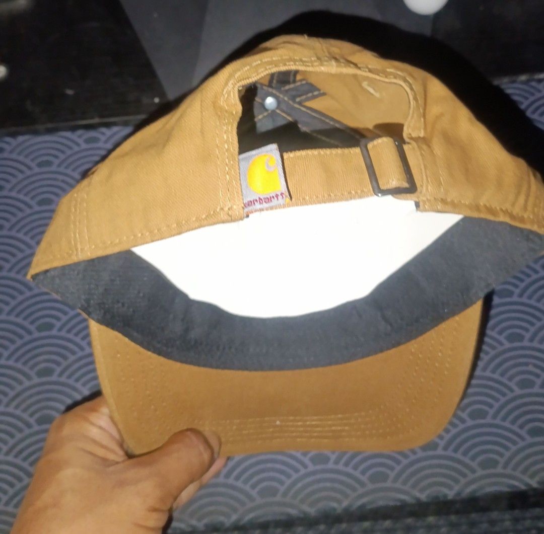 Carhartt (Category: Caps & Hats) located in Caloocan City. Submitted by renzyyy0522 (Listing ID 1467099029, Image 3). Description: - Brand: Carhartt - Color: Brown - Condition: Brand new with original tags, never worn - Technology: Carhartt Force sweat-wicking and fast-drying fabric - Design: Iconic Carhartt patch on front - Fit: Adjustable strap with brass slider and logo label - Ideal for daily wear.