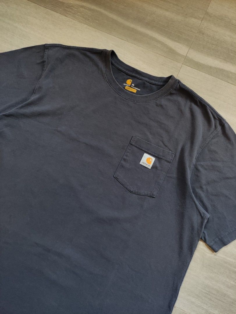 Carhartt K87 NVY Pocket Tee (Category: Tshirts & Polo Shirts ) located in Calamba. Submitted by alorbis96758 (Listing ID 1467082259, Image 2). Description: Chest Width : 25" Length : 31" Best Fit : XL ~ 2XL Color Rate : 9 Flaws : Nail Holes, Minor Sunfade on Neckline.