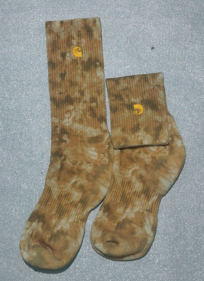Carousell Carhartt Tie-Dye Crew Socks (Category: Socks) located in Tagum. Submitted by tripthrift2026 (Listing ID 1467025318, Image 1). Description: - Brand: Carhartt - Design: Brown and white tie-dye pattern - Details: Ribbed knit texture with embroidered logo near the cuff - Height: Standard crew - Condition: Brand new - Perfect for daily streetwear and casual fits.