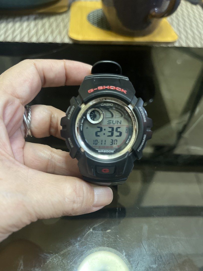 Casio G-Shock Digital Watch with Box (Category: Men's Watches) located in Quezon City. Submitted by donnabelle7572 (Listing ID 1467158256, Image 2). Description: - Authentic Casio G-Shock digital watch in classic black with stylish red lettering - Rugged round dial design with a durable resin strap built for daily wear - 200-meter water resistance, great for swimming and outdoor activities - Long-lasting battery powered with up to a 10-year batte
