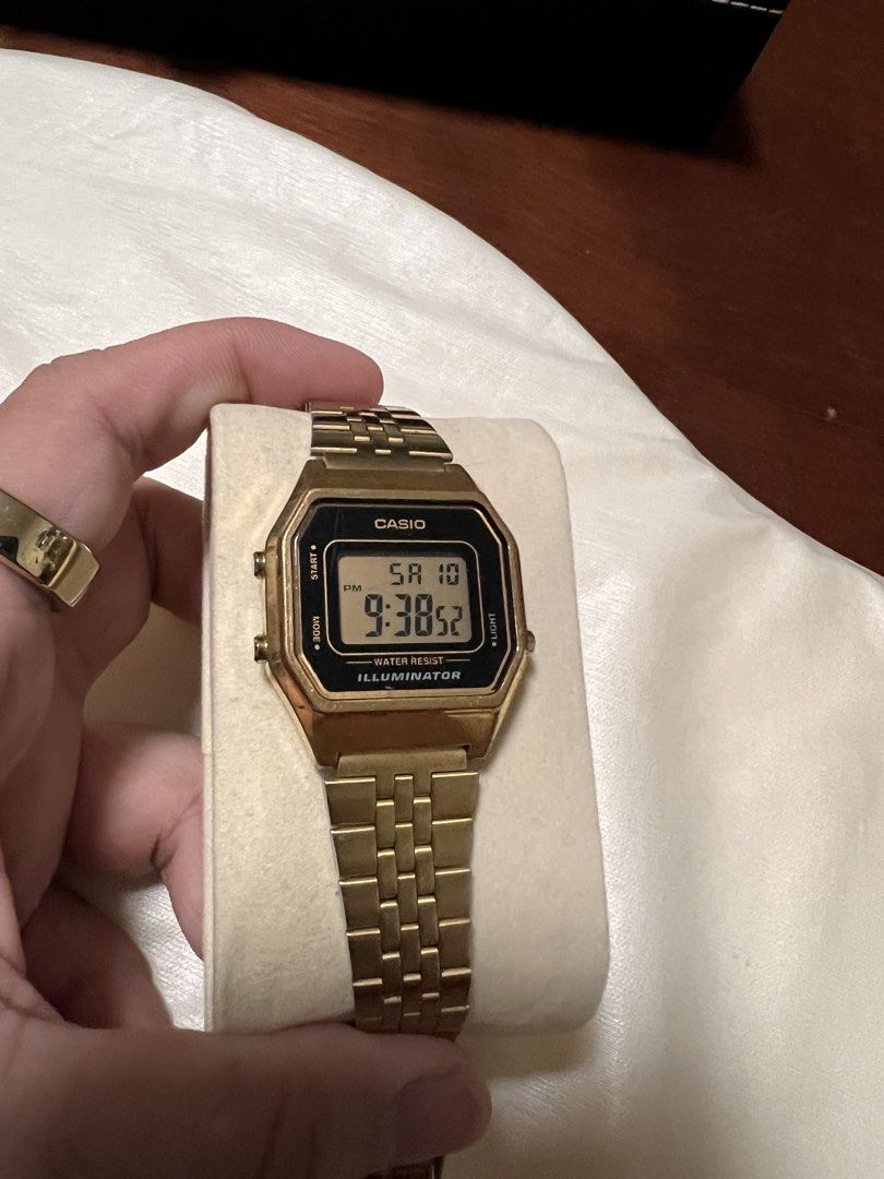 Casio Vintage Gold Digital Watch Illuminator (Category: Women's Watches) located in Manila. Submitted by kai.168 (Listing ID 1467112810, Image 3). Description: - Brand: Casio Digital Watch - Color: Elegant gold-tone metal finish - Display: Square black face with gold bezel and standard digital display (day, date, time) - Features: Water resistant and built-in illuminator backlight - Strap: Matching gold metal link bracelet - Style: Classic retro 