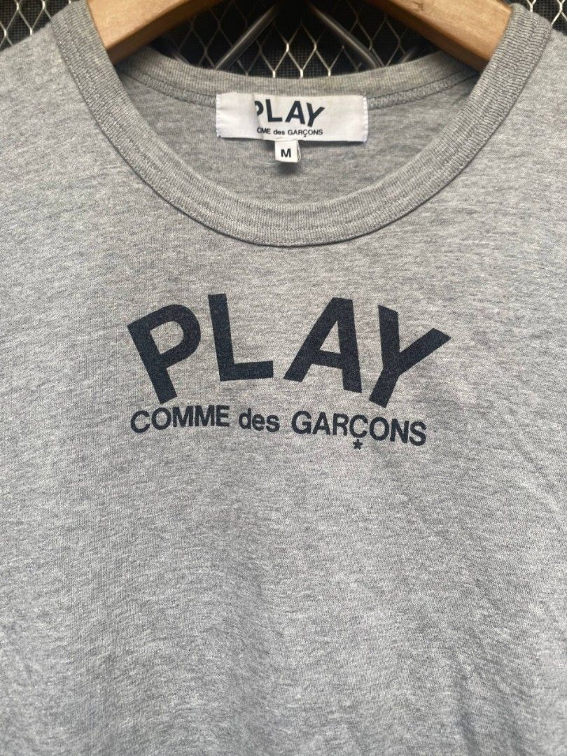 CDG Play (Category: Shirts) located in Muntinlupa City. Submitted by eksenathriftshop (Listing ID 1467097282, Image 2). Description: Good Condition Issue: Minimal Hairlines and stain (check photos) Size medium on tag.