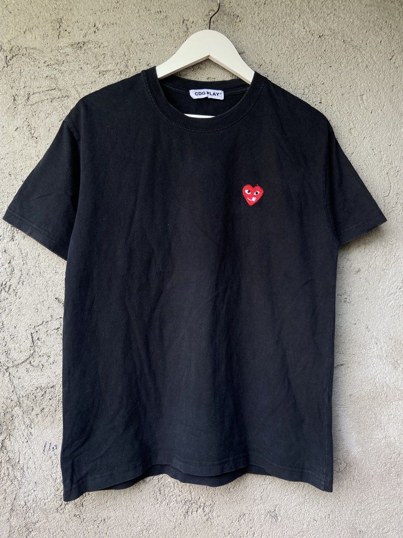 Cdg Play Black Tshirt (Category: Formal Shirts) located in Cavite. Submitted by abasolo_jv (Listing ID 1467006081, Image 1). Description: Good Condition 9.8/10 Color Rate No pin hole cut wash tag 20.4x26 Dimes try to offer.