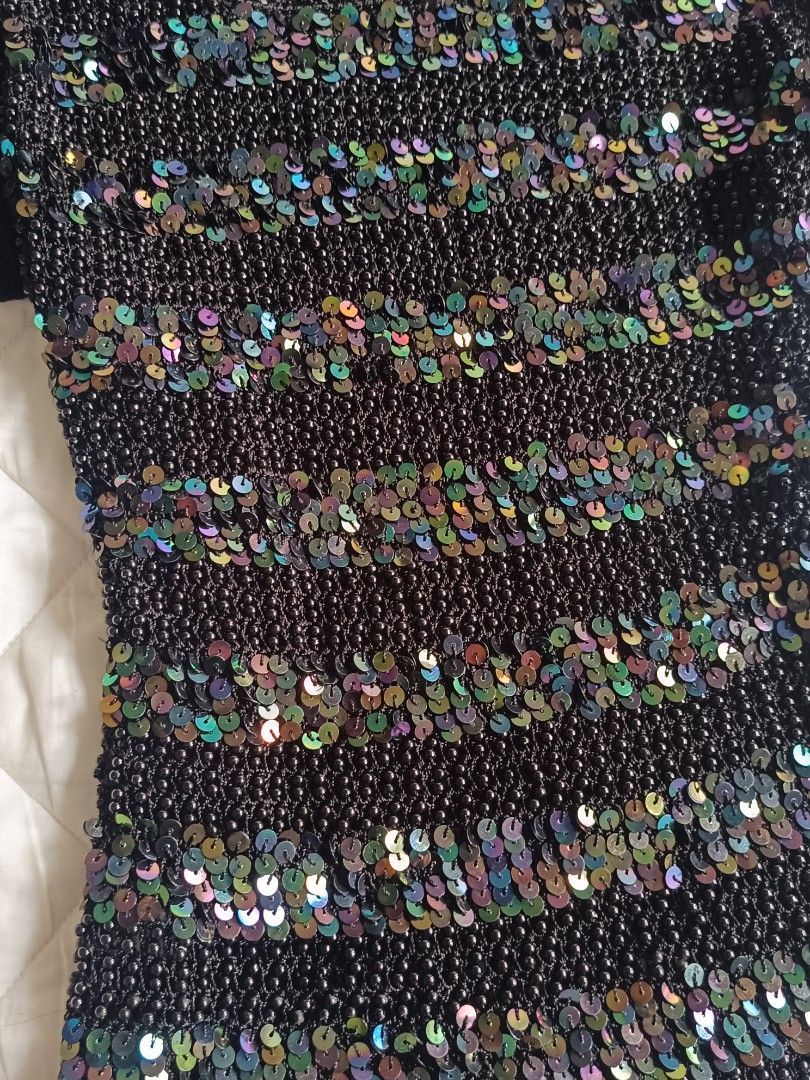 Champaign Black Sequin Beaded knitted Short Sleeve Top (Category: Blouses) located in Cebu City. Submitted by vionchan (Listing ID 1466971249, Image 2). Description: - Brand: Champaign - Style: Short-sleeve scoop neck top - Details: Covered in colorful iridescent sequins and tiny black syper fave hq fabric beads - Material: Crocheted knit mesh base - Perfect for: Parties, clubbing, and night outs.