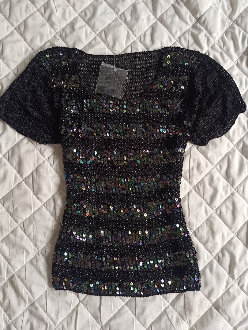 Champaign Black Sequin Beaded knitted Short Sleeve Top (Category: Blouses) located in Cebu City. Submitted by vionchan (Listing ID 1466971249, Image 1). Description: - Brand: Champaign - Style: Short-sleeve scoop neck top - Details: Covered in colorful iridescent sequins and tiny black syper fave hq fabric beads - Material: Crocheted knit mesh base - Perfect for: Parties, clubbing, and night outs.