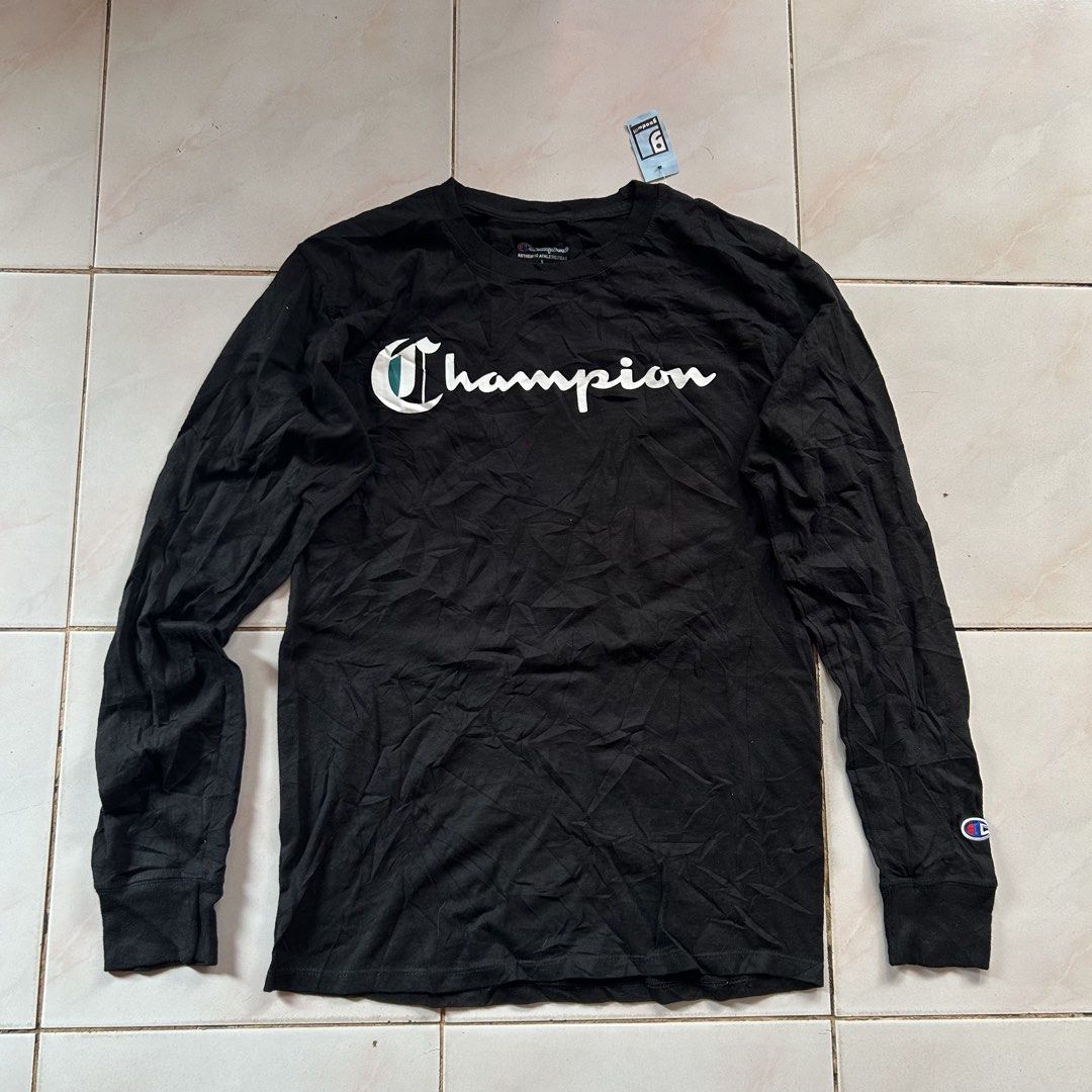 Champion Black Long Sleeve 🔥 (Category: Activewear) located in Jinoba-an. Submitted by eegiboy (Listing ID 1467026827, Image 1). Description: - Brand: Champion - Item: Long sleeve shirt - Color: Classic black with white and teal cursive logo - Size: Small - Material: Soft cotton - Features: Ribbed cuffs and iconic embroidered patch on left wrist - Condition: Excellent / Great for casual wear Wts: Champion longsleeve 🔥 Small-medium Dimes:19/27 G