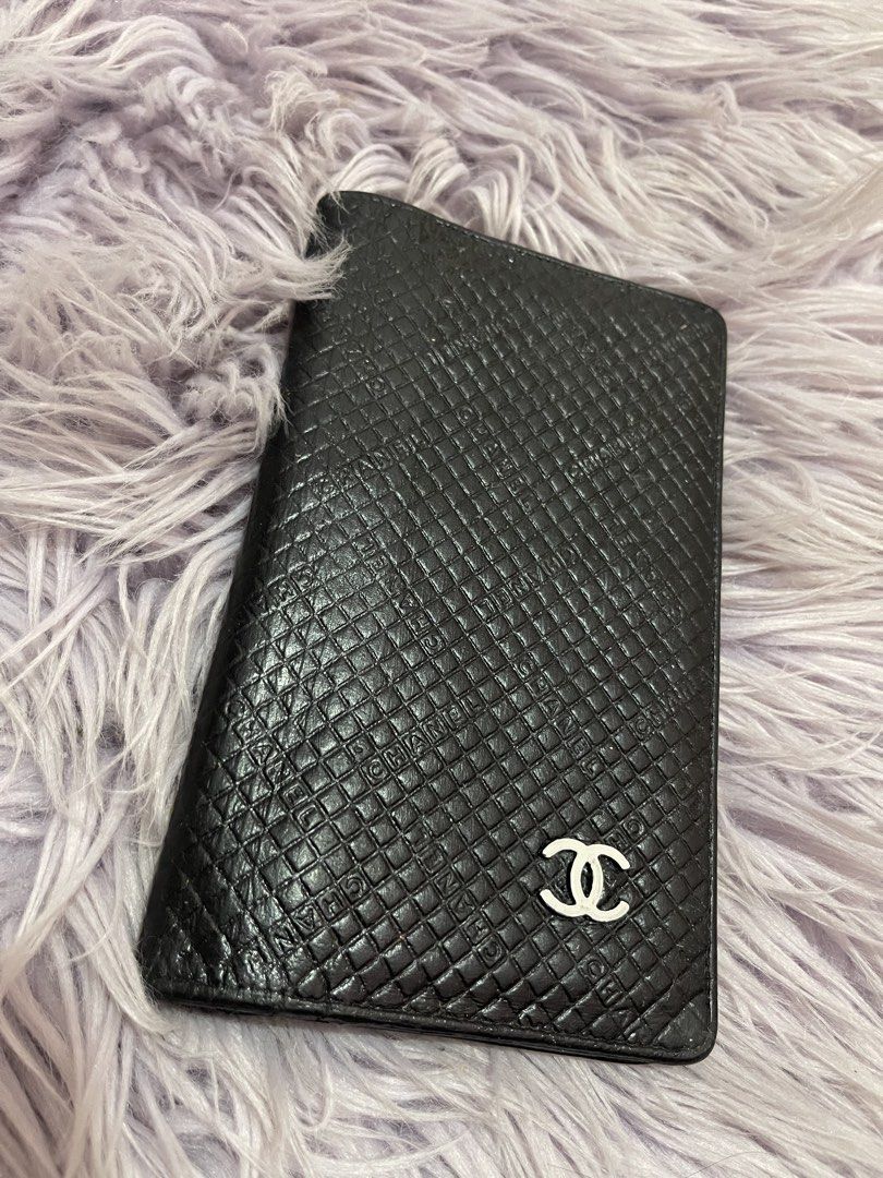 Chanel Black Quilted Long Wallet (Category: Wallets & Card holders) located in Cabanatuan. Submitted by imported2023 (Listing ID 1467103611, Image 1). Description: - Brand: Chanel - Material: Premium black quilted leather with embossed exterior lettering - Hardware: Silver-tone interlocking CC logo - Interior: Multiple card slots, cash compartments, and a zippered pocket - Lining: Beige fabric with repeating Chanel branding - Origin: Made in Ital
