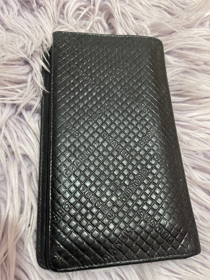 Chanel Black Quilted Long Wallet (Category: Wallets & Card holders) located in Cabanatuan. Submitted by imported2023 (Listing ID 1467103611, Image 3). Description: - Brand: Chanel - Material: Premium black quilted leather with embossed exterior lettering - Hardware: Silver-tone interlocking CC logo - Interior: Multiple card slots, cash compartments, and a zippered pocket - Lining: Beige fabric with repeating Chanel branding - Origin: Made in Ital