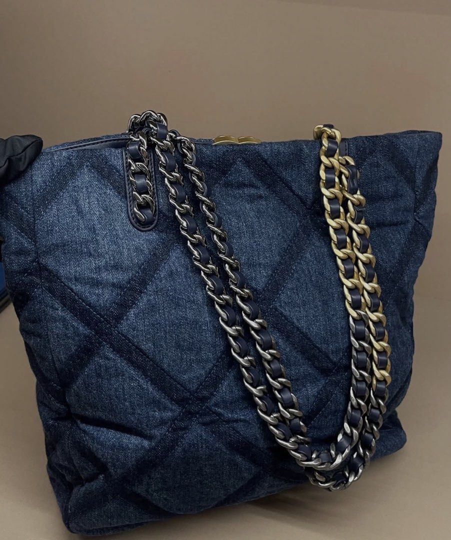 Chanel Denim Quilted Tote Bag (Category: Tote Bags) located in Makati City. Submitted by dgcurated09 (Listing ID 1467147785, Image 2). Description: - Authentic Chanel dark blue denim tote bag with chic quilted diamond pattern - Stunning mixed gold-tone and ruthenium hardware - Iconic interlocking CC turn-lock front closure - Premium dark blue leather trim on top edge and handles - Navy fabric interior featuring a zipper pocket and key leash - Int