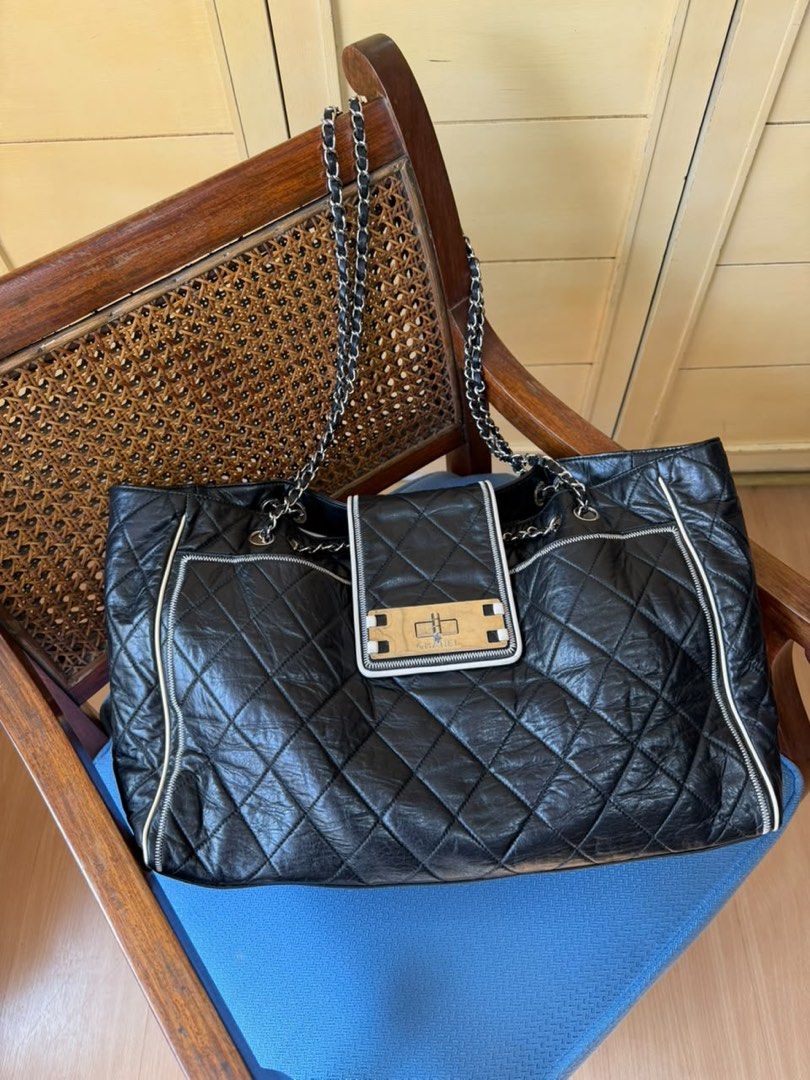 Chanel East West Tote Bag (Category: Luxury Bags & Wallets) located in Mandaluyong City. Submitted by marceditems (Listing ID 1467122944, Image 2). Description: Chanel East West Tote Series 12, hologram intact Made of aged calfskin leather With Reissue Hardware Chain shoulder straps 40cm width With signs of use .