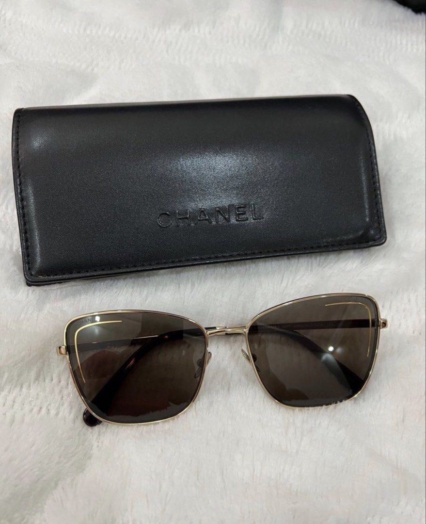 Chanel Square Gold Sunglasses with Case (Category: Sunglasses & Eyewear) located in Manila. Submitted by kai.168 (Listing ID 1467163569, Image 1). Description: - Authentic Chanel square sunglasses - Gold metal frame with gradient dark brown lenses - Subtle Chanel branding on lens and gold lettering on temples - Tortoise shell pattern at ear tips and CC-stamped nose pads - Includes original black leather hard case with embossed logo.