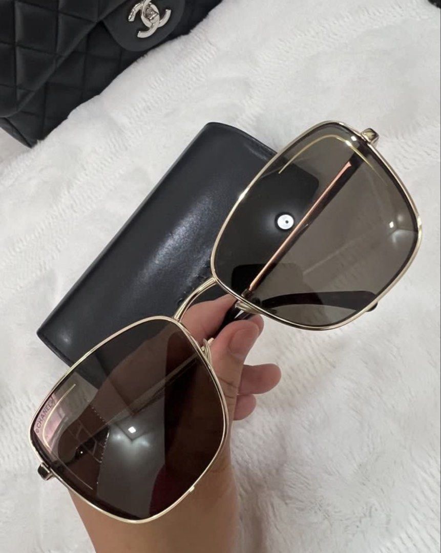 Chanel Square Gold Sunglasses with Case (Category: Sunglasses & Eyewear) located in Manila. Submitted by kai.168 (Listing ID 1467163569, Image 2). Description: - Authentic Chanel square sunglasses - Gold metal frame with gradient dark brown lenses - Subtle Chanel branding on lens and gold lettering on temples - Tortoise shell pattern at ear tips and CC-stamped nose pads - Includes original black leather hard case with embossed logo.