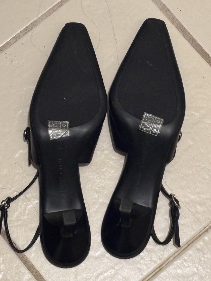 Charles & Keith Black Studded Kitten Heels (Category: Heels) located in Manila. Submitted by cosmic.chalkstripes (Listing ID 1467149256, Image 3). Description: - Brand: Charles & Keith - Color: Classic Black - Style: Pointed toe slingback kitten heels with silver stud accents - Fit: Adjustable metal buckle strap - Condition: Excellent, sole stickers still attached with minimal wear - RFS: size too big .