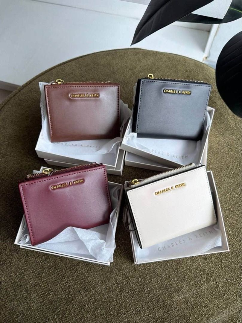 Charles & Keith Envelope Cardholder Wallet (Category: Wallets & Card holders) located in Manila. Submitted by liahsells (Listing ID 1467036478, Image 1). Description: - Brand: Charles & Keith - Design: Envelope style with zip top closure and embossed logo - Colors Available: Sage green, black, brown, and off-white - Size: Compact, pocket-friendly, ideal for daily essentials - Inclusions: Comes with original white packaging box - Condition: Brand 