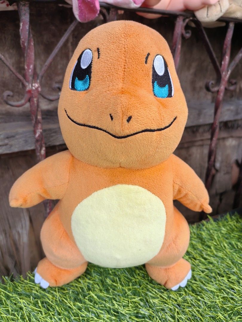 Charmander Pokemon Plush Soft Toy 1997 30cm (Category: Plushies & Soft Toys) located in Paranaque City. Submitted by furugiyafinds (Listing ID 1467010039, Image 1). Description: - Authentic 1997 Nintendo Charmander plush by 3rd Round - Crafted from soft orange fabric with a cream belly patch - Features embroidered facial features and foot claws - Adorned with a classic red and yellow tail flame - Clean surface with vibrant colors, ideal for displ