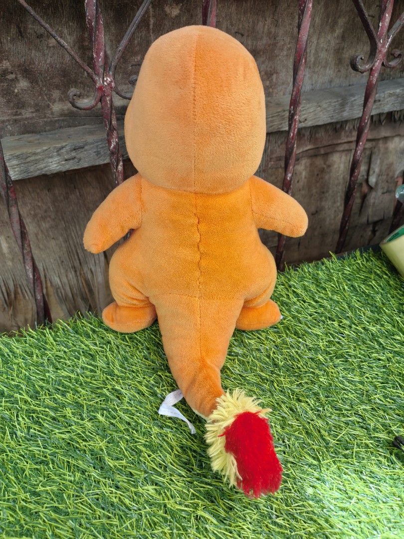 Charmander Pokemon Plush Soft Toy 1997 30cm (Category: Plushies & Soft Toys) located in Paranaque City. Submitted by furugiyafinds (Listing ID 1467010039, Image 2). Description: - Authentic 1997 Nintendo Charmander plush by 3rd Round - Crafted from soft orange fabric with a cream belly patch - Features embroidered facial features and foot claws - Adorned with a classic red and yellow tail flame - Clean surface with vibrant colors, ideal for displ