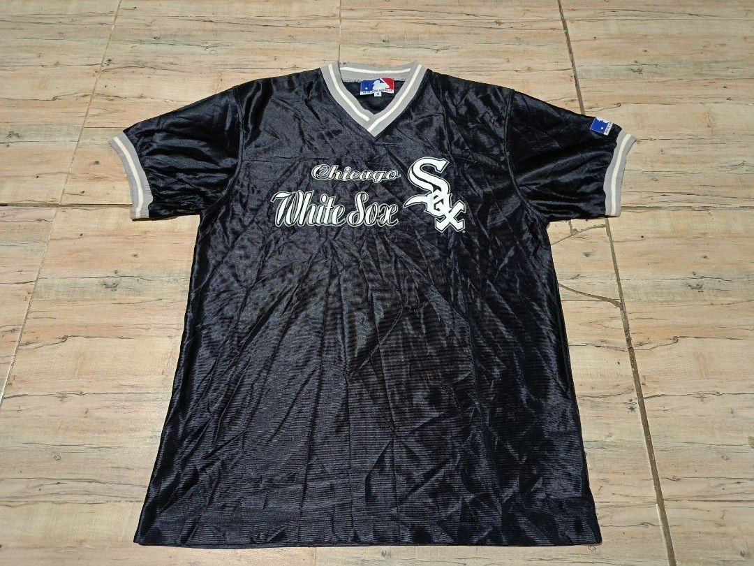 Chicago White Sox MLB V-Neck Jersey Black (Category: Activewear) located in Bansalan. Submitted by tripandthrift (Listing ID 1466997817, Image 1). Description: - Authentic Chicago White Sox MLB V-Neck jersey in black - Size: Medium -20/28 Dimes - Classic team lettering on the chest with batterman logo at the collar and sleeve - Stylish grey and white striped ribbed collar and sleeve cuffs - Made in Vietnam - Care tag includes washing instructions