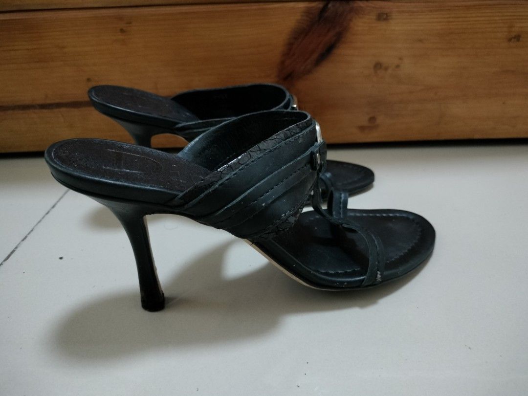 Christian Dior Black Leather Logo CD Sandals (Category: Flats & Sandals) located in San Mateo. Submitted by shop_with_nicer (Listing ID 1466971864, Image 2). Description: - Brand: Christian Dior - Style: Slip-on mule with thong strap - Color: Black - Material: Leather - Size: 37 (Made in Italy) - Heel Height: Approx. 3 inches - Hardware: Silver-tone CD logo - Condition: Pre-loved with minor scuff marks on bottom soles and slight wear on heel tips