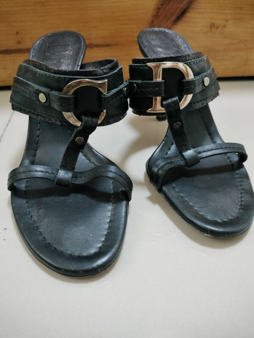 Christian Dior Black Leather Logo CD Sandals (Category: Flats & Sandals) located in San Mateo. Submitted by shop_with_nicer (Listing ID 1466971864, Image 1). Description: - Brand: Christian Dior - Style: Slip-on mule with thong strap - Color: Black - Material: Leather - Size: 37 (Made in Italy) - Heel Height: Approx. 3 inches - Hardware: Silver-tone CD logo - Condition: Pre-loved with minor scuff marks on bottom soles and slight wear on heel tips