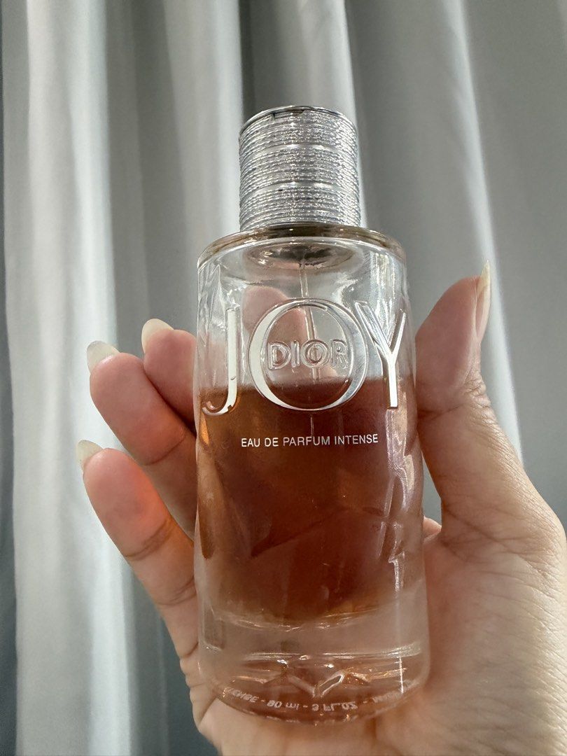 Christian Dior Joy Eau de Parfum Intense 90ml (Category: Fragrance & Deodorants) located in San Antonio. Submitted by luvstuffffff (Listing ID 1467038539, Image 1). Description: - Brand: Christian Dior - Fragrance: Joy Eau de Parfum Intense - Size: Large 90ml bottle - Condition: Approx. 3/4 full - Scent Profile: Concentrated floral with warm woody base notes - Design: Elegant silver ribbed cap - Origin: Made in France by Parfums Christian Dior.