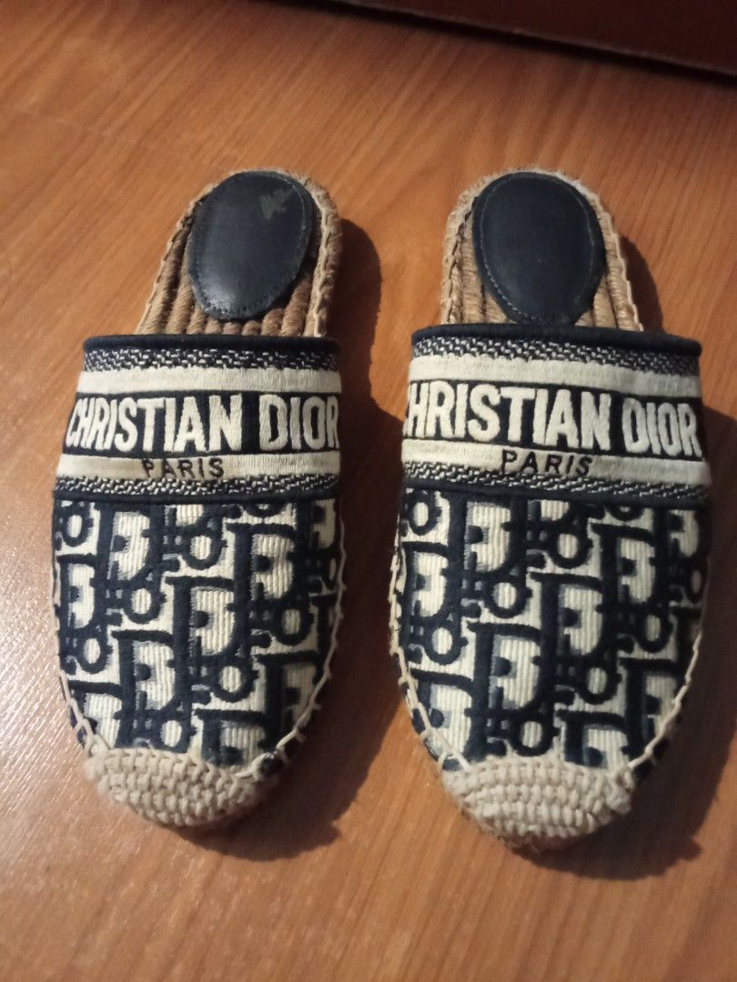 Christian Dior Paris Oblique Mules Slides (Category: Sneakers & Footwear) located in Las Pinas. Submitted by Gienuine (Listing ID 1467046980, Image 1). Description: - Authentic Christian Dior Paris embroidered mules - Classic navy blue Oblique monogram pattern with signature band - Comfortable slip-on design with woven jute sole - Dark leather heel pad with minor scuffs from gentle wear - Clean fabric upper and structured toe, well-maintained ove
