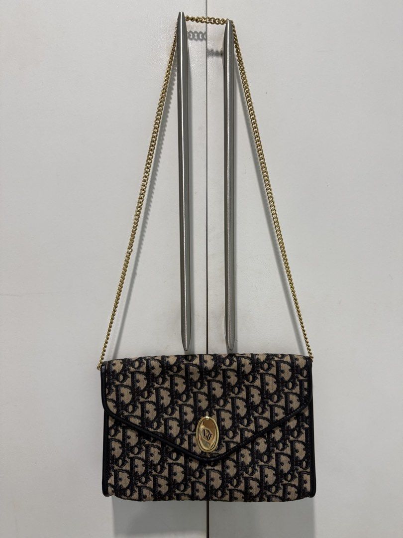 Christian Dior Trotter Monogram Envelope Shoulder Bag or Clutch Bag Vintage Bag (Category: Shoulder Bags) located in Quezon City. Submitted by lenitz (Listing ID 1467029259, Image 2). Description: *Authentic Christian Dior Trotter Monogram Envelope *vintage design *long or short Shoulder Bag *can also be a clutch bag *chains, leather, canvas are all in excellent condition *there is a bit smell of cabinet *front snap also working *vintage bag *can